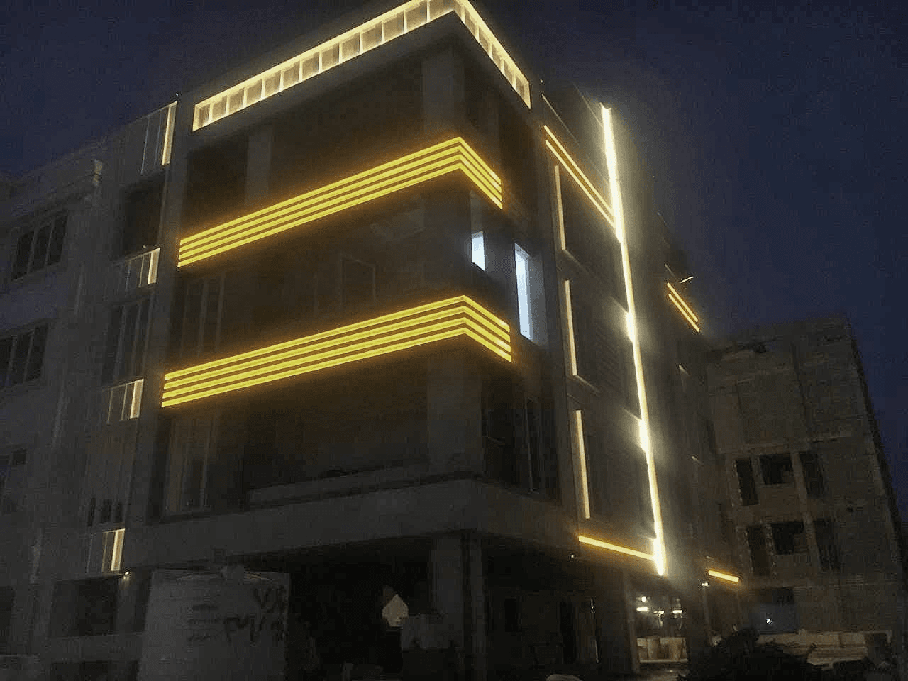 Building exterior showing stone facade with horizontal banding